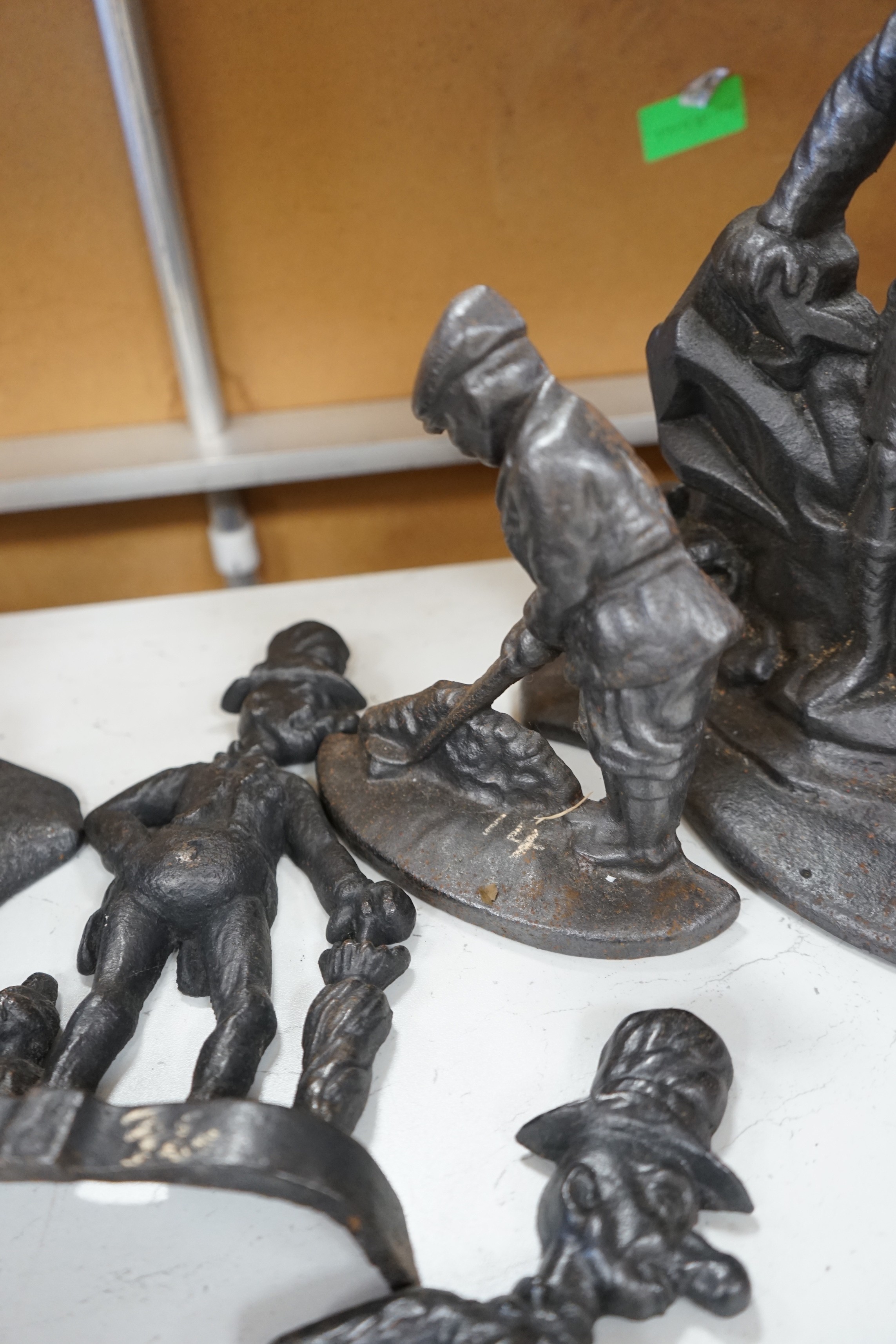 Five assorted Victorian figural cast iron doorstops